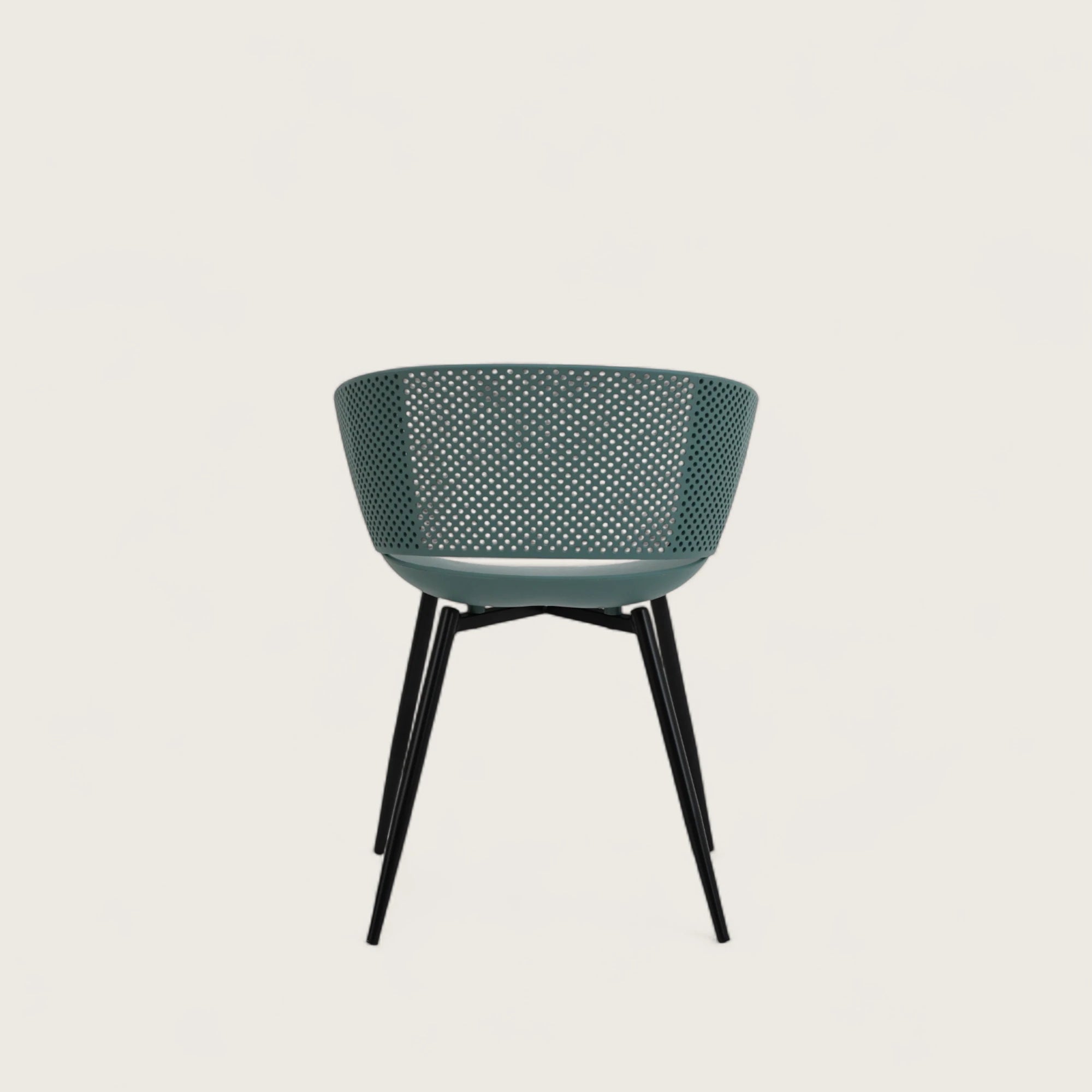 Sedia con scocca in polipropilene colore petrolio, schienale avvolgente e gambe in metallo nero opaco, ideale per sale da pranzo, cucine e spazi contract.